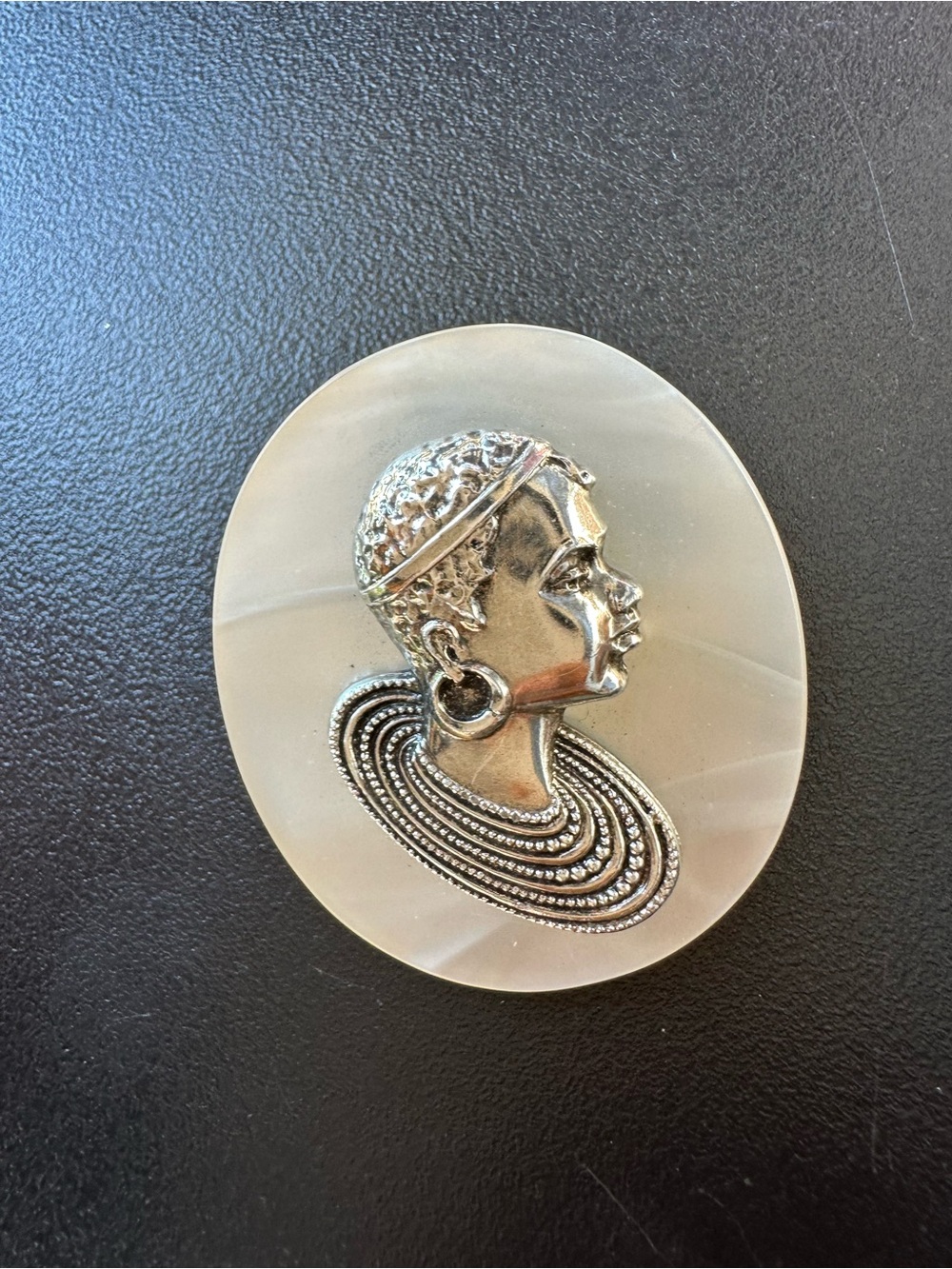 Vintage mother of pearl Afrocentric brooch